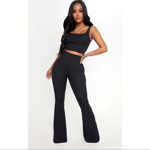 PRETTYLITTLETHING Ribbed Flared Trousers.